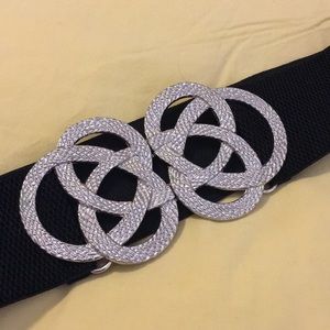 black belt with statement silver buckle